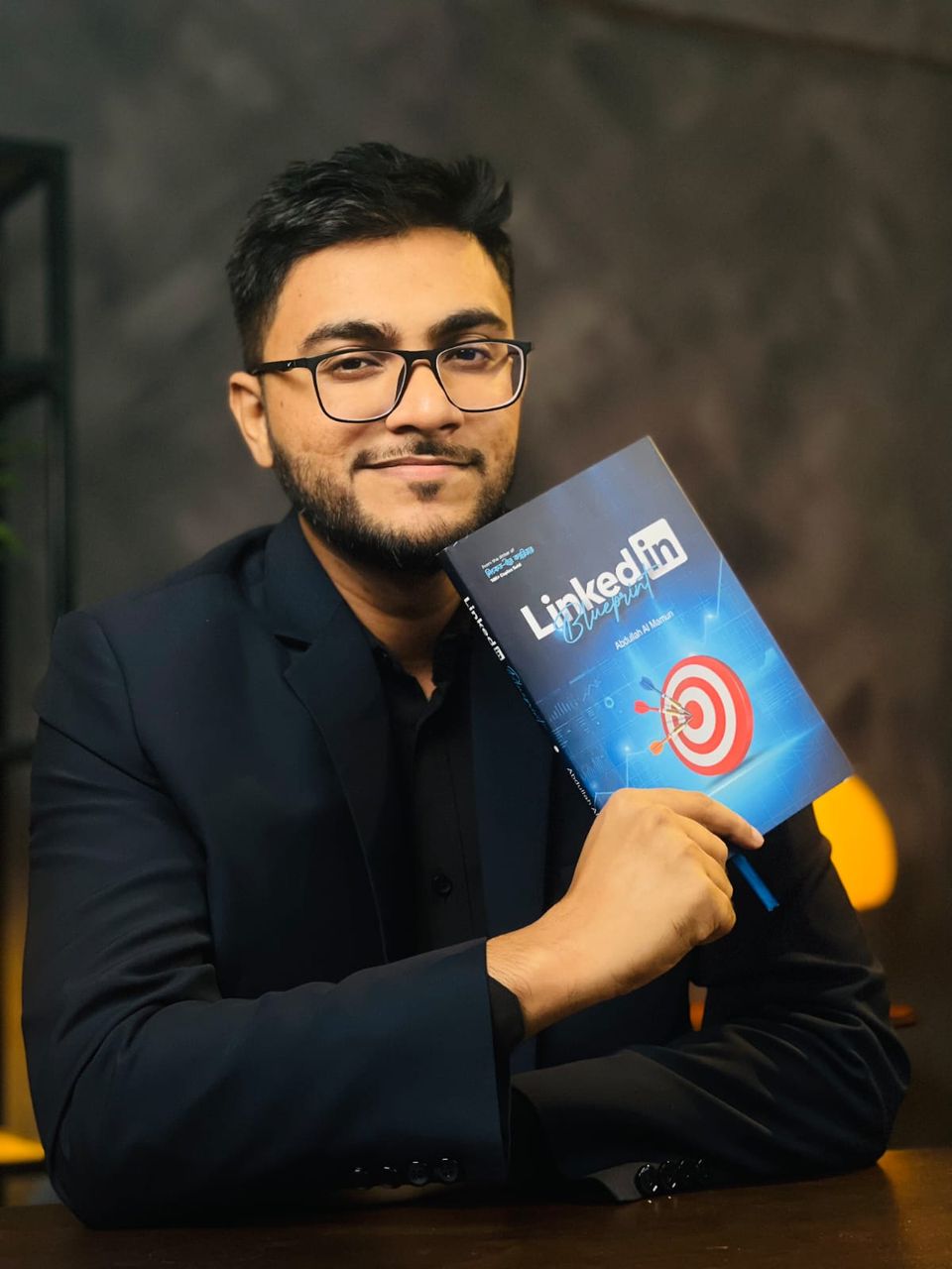 Abdullah Al Mamun holding LinkedIn Blueprint